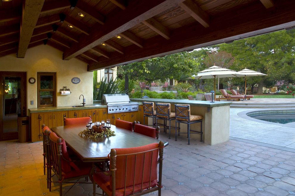 Islander Pools for a Mediterranean Patio with a Pool Deck and Saratoga Estate by Kikuchi + Kankel Design Group