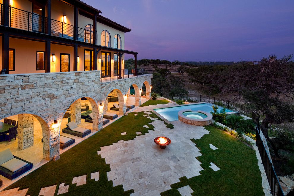 Jenkins Brick for a Mediterranean Landscape with a Outdoor Chaise Lounge and Flood Plain Home on Lake Travis Outdoor Living by Jenkins Custom Homes