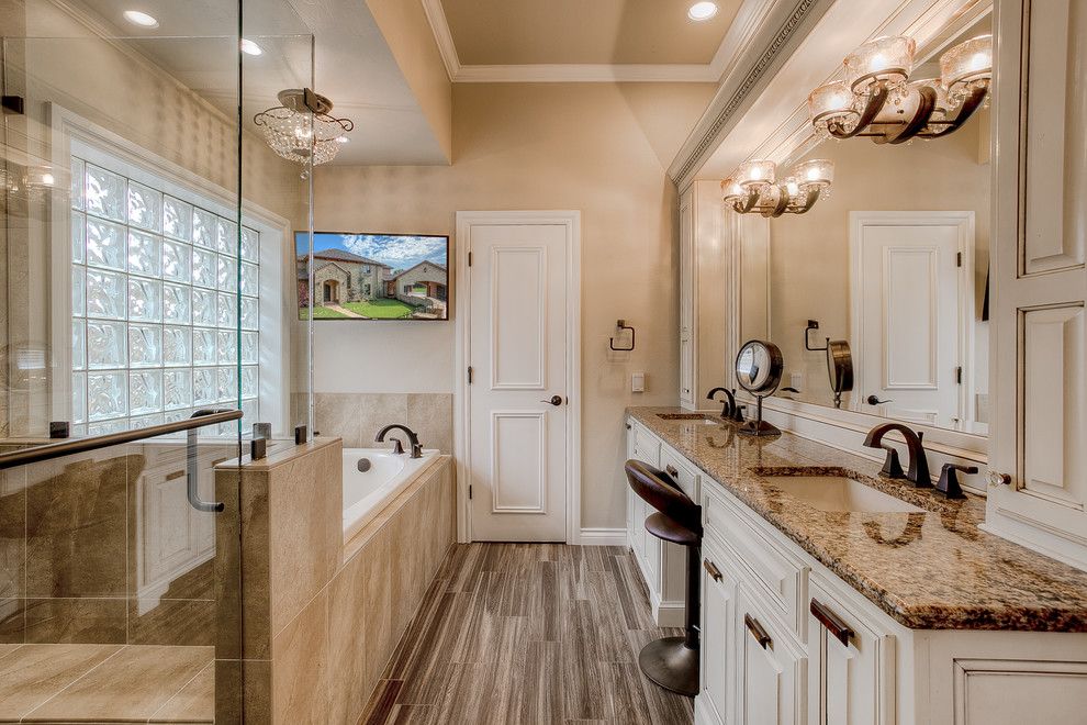 Jetta Tubs for a Traditional Bathroom with a Crystal Ceiling Light and Master Bath Remodel by Clayburn Development and Pools