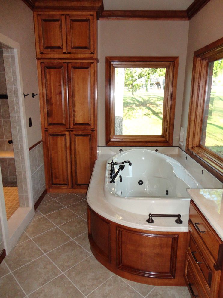 Jetta Tubs for a Traditional Bathroom with a Marble Tub Deck and Master Suite Addition by Birmingham Remodeling and Construction