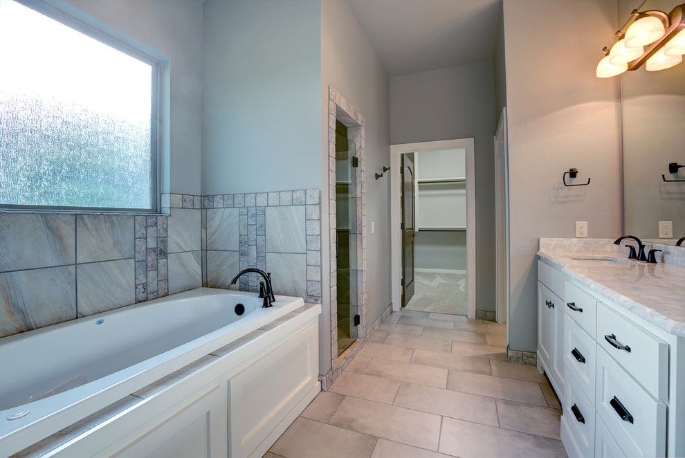 Jetta Tubs for a Transitional Bathroom with a Shower and Spring Parade of Homes 2015 by Adams Kirby Homes