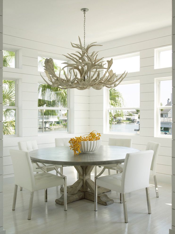 John Houston Custom Homes for a Beach Style Dining Room with a Transom Windows and Luxe Galveston Project by Laura C. Singleton Interiors