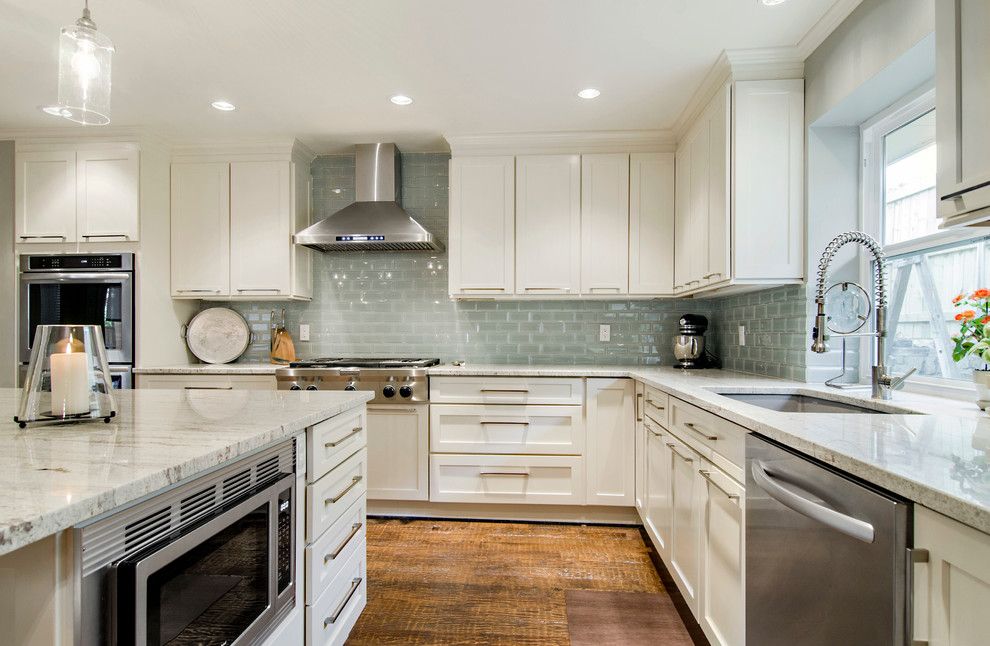 Kashmir White Granite for a Transitional Kitchen with a Beveled Glass and Looking at the Range Wall by Hatfield Builders & Remodelers