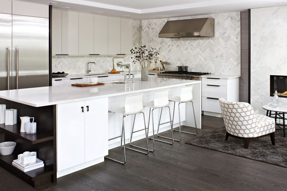 Kentwood Flooring for a Contemporary Kitchen with a Stainless Steel Appliances and Modern White Kitchen by Croma Design Inc