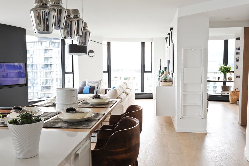 Kentwood Flooring for a Modern Dining Room with a Natural Wood Floor and West 2nd Street, North Vancouver by Gaile Guevara