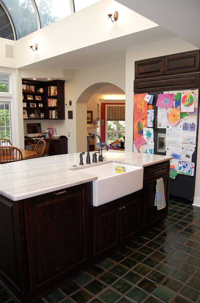 Kitchen Sink Lyrics for a Traditional Kitchen with a Black Appliances and Private Residence by Leslie Stephens Design