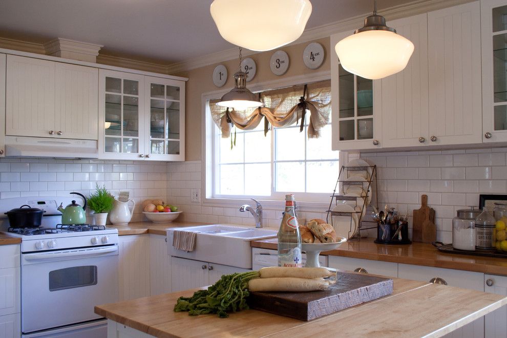 Kitchen Sink Lyrics for a Traditional Kitchen with a Glass Cabinets and Farmhouse Kitchen by Jennifer Grey Interiors