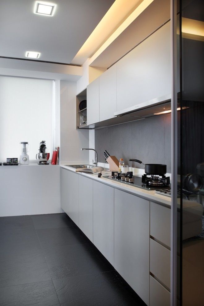 Kith Cabinets for a Contemporary Kitchen with a Black Floors and Black and White by Black N White House