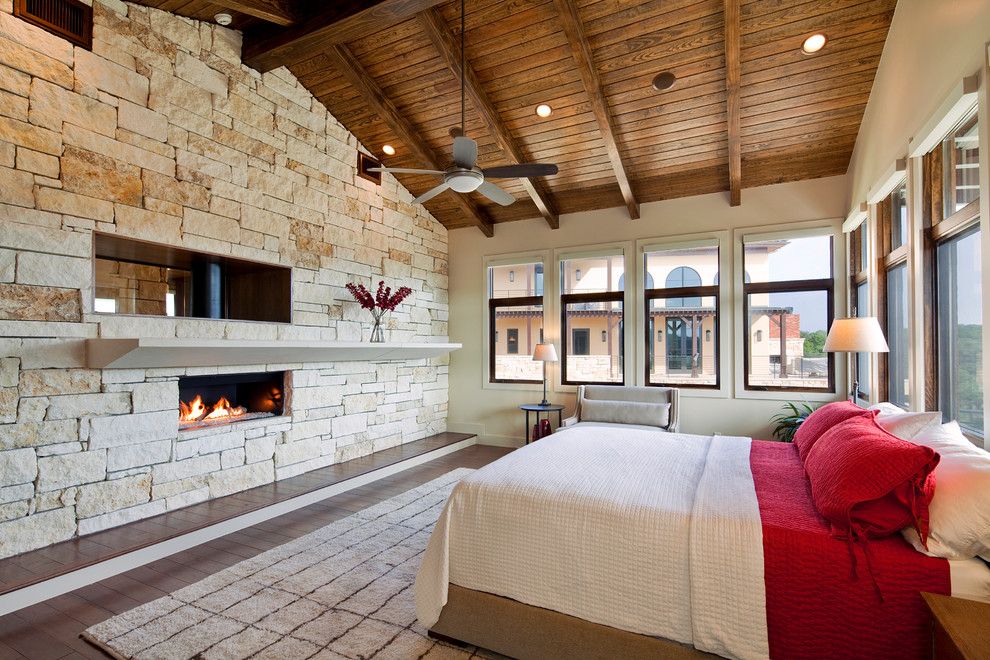 Knock Down Ceiling for a Mediterranean Bedroom with a Exposed Beams and Master Bedroom by Jenkins Custom Homes