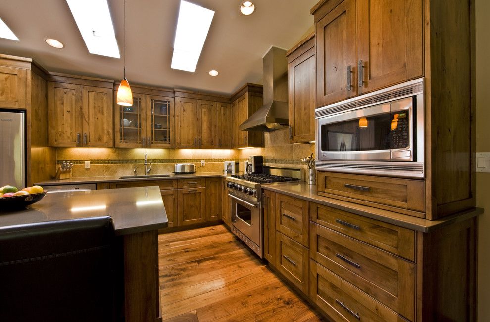 Knotty Alder Cabinets for a Contemporary Kitchen with a Contemporary and Glen Crescent Renovation by Sticks and Stones Design Group Inc.