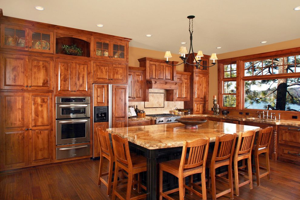 Knotty Alder Cabinets for a Rustic Kitchen with a Custom Hood and Harrison Idaho by Wingren Design