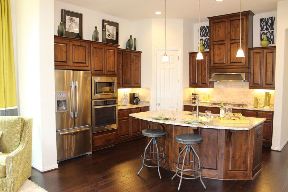 Knotty Alder Cabinets for a Traditional Kitchen with a Raised Panel and Model Home Kitchen with Knotty Alder Cabinets by Taylorcraft Cabinet Door Company