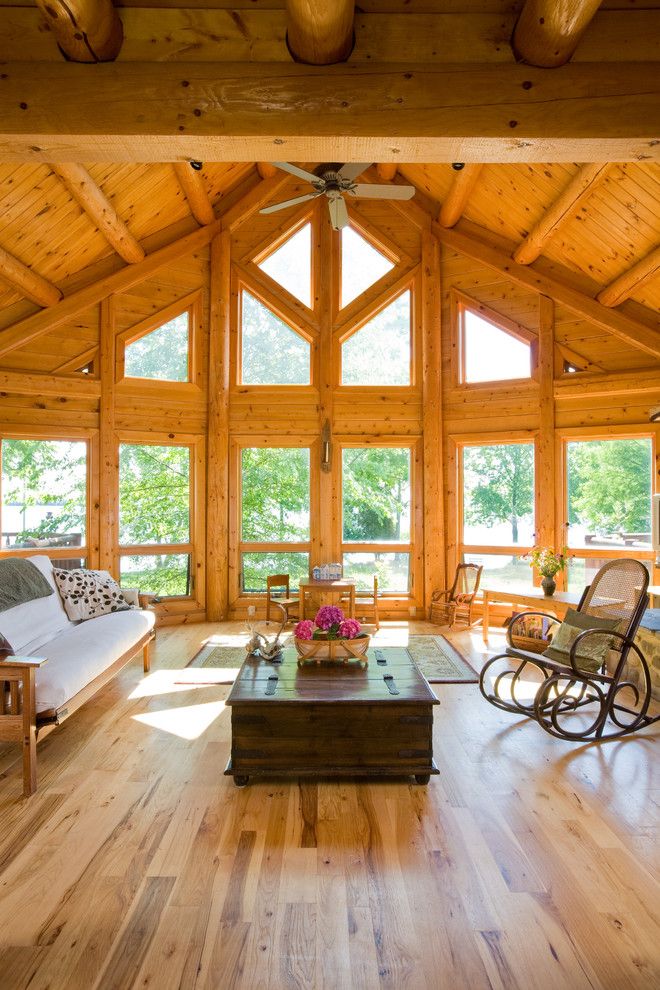 Knotty Pine for a Traditional Living Room with a Wood Rocking Chair and Chesapeake Bay Waterfront Log Home by Katahdin Cedar Log Homes