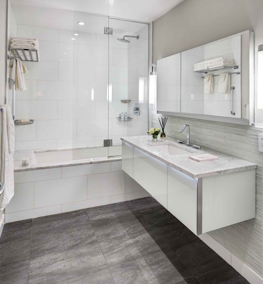 Kraus Flooring for a Contemporary Bathroom with a Glass Shower Shield and Bowery Downtown Manhattan Residence by United Elite Group