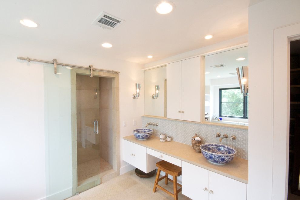 Kuzco for a Contemporary Bathroom with a White Drawers and Master Bath After by Realty Restoration, Llc