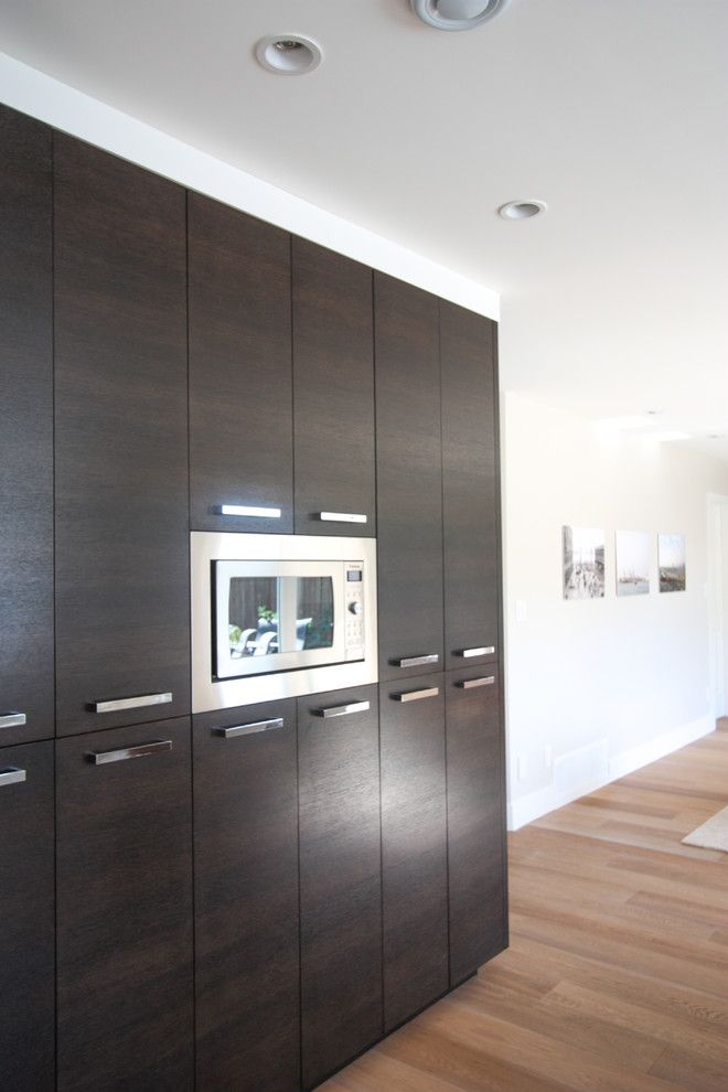 Kuzco for a Transitional Kitchen with a White Cabinets and South Delta Kitchen & Bath by Sarah Gallop Design Inc.