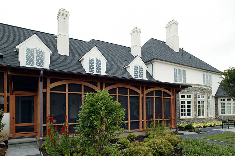 Lanai Porch for a Traditional Exterior with a Mansard Roof and English Country House by Dewson Construction Company