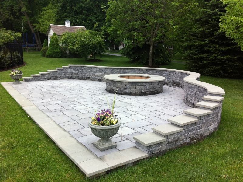 Landscapers Supply for a Traditional Patio with a Firepit and Free Standing Patio with Custom Sitting Wall by Woodward Landscape Supply