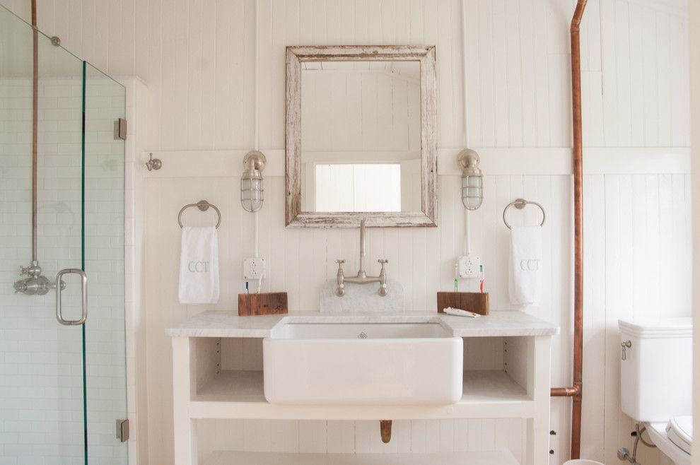 Lefroy Brooks for a Beach Style Bathroom with a Farm Sink and Southern Ct Beach Home by Allee Architecture + Design, Llc