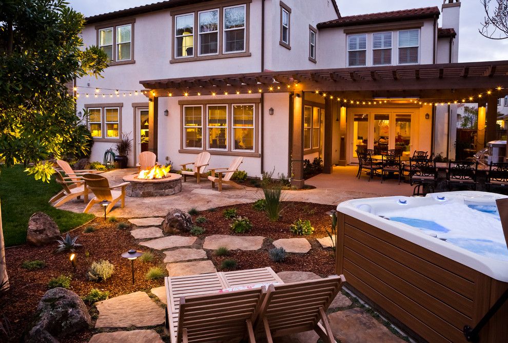 Lifescapes for a Rustic Patio with a Fire Pit and Almaden Retreat by Lifescape Custom Landscaping, Inc.