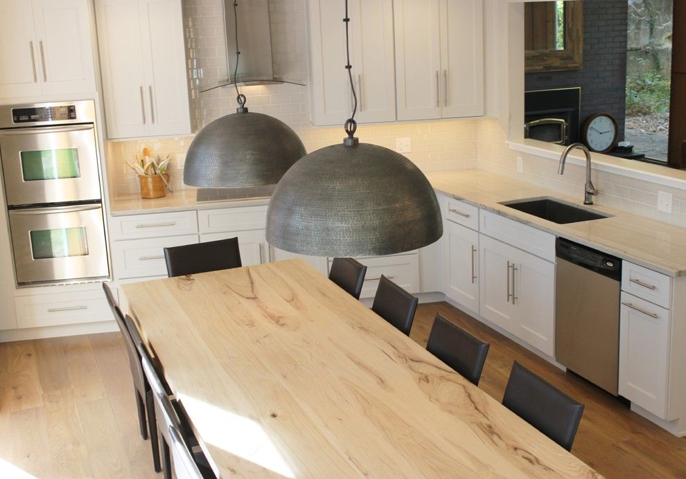 Lockwood Flooring for a Transitional Kitchen with a Extra Large Dining Table and Bettendorf, Ia  Kitchen Remodel with Interesting Angled Layout by Village Home Stores