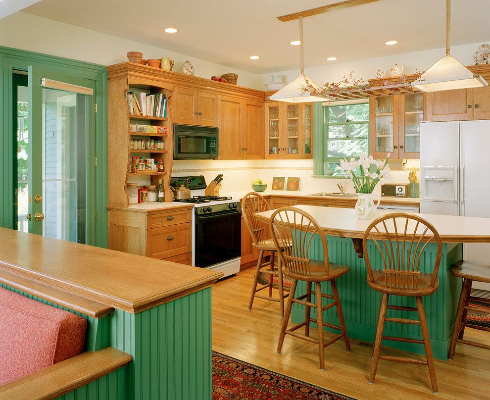 Lockwood Flooring for a Victorian Kitchen with a Glass Door and New Life to a Newton Victorian by Lockwood Construction Company Inc