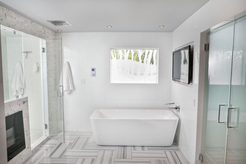 Louisville Tile for a Modern Bathroom with a Fireplace and Stanton Master Suite by Jonathan Stanton, Inc