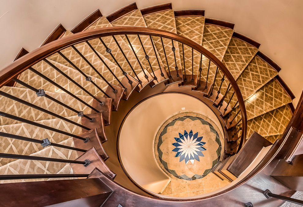 Low Pile Carpet for a Mediterranean Staircase with a Wrought Iron Spindles and Polo Club Custom Home by Augusten Muller Homes