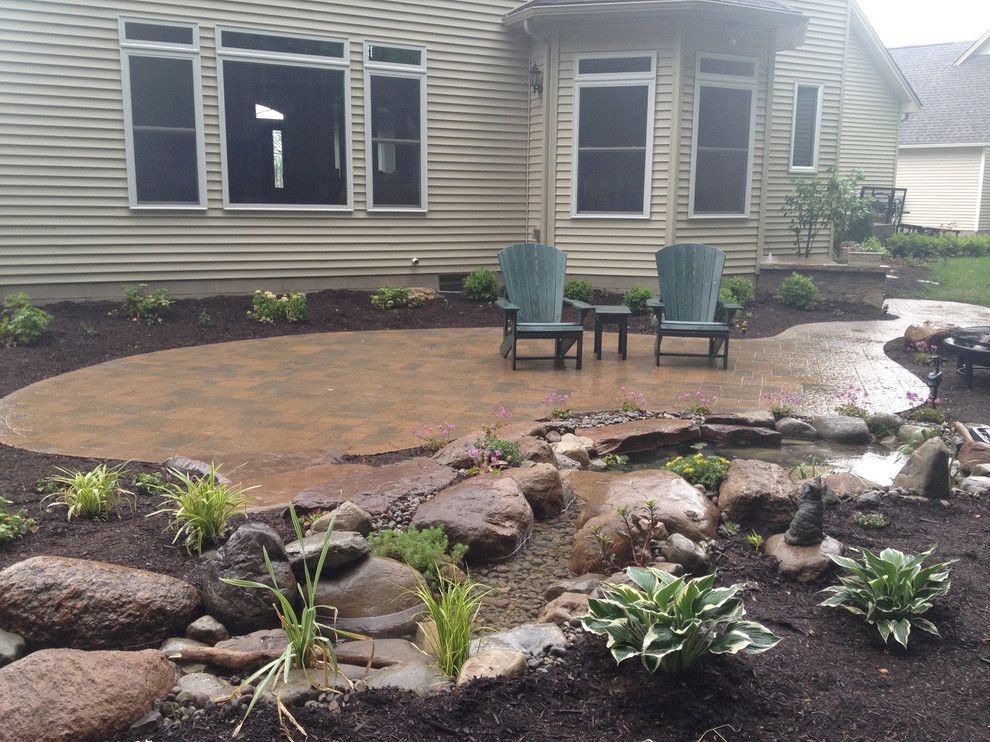 Lowes Albany Ny for a Traditional Patio with a Pond and Patios, Steps, Lighting, Ecosystem Koi Pond, Plantings in Rochester Ny by Acorn Ponds & Waterfalls