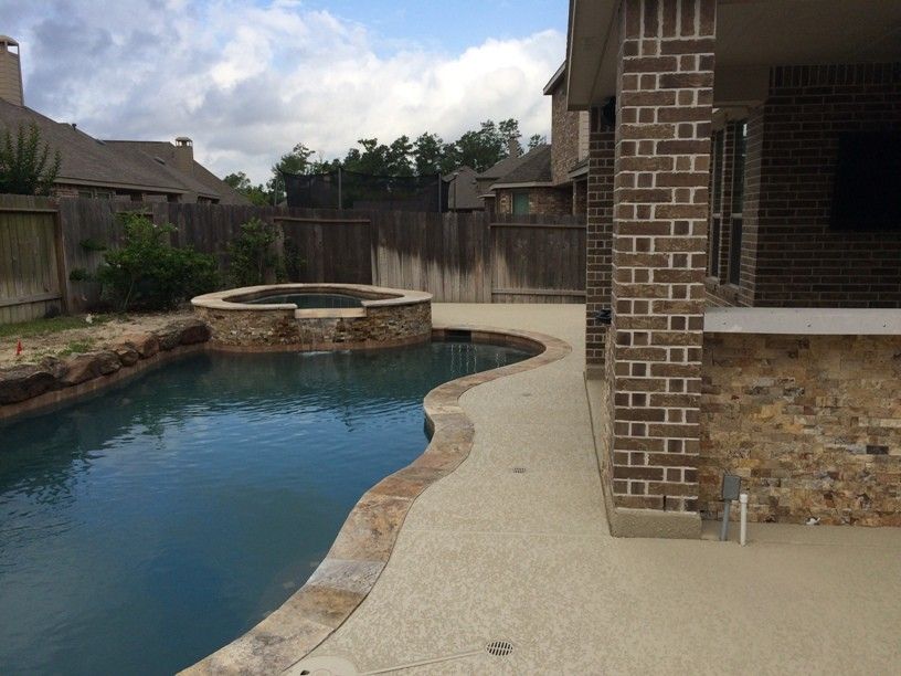 Lowes Memphis for a Rustic Patio with a Indoor Outdoor and Houston Outdoor Kitchen with Traeger Grill and Scabos Split Face Stone by Outdoor Homescapes of Houston