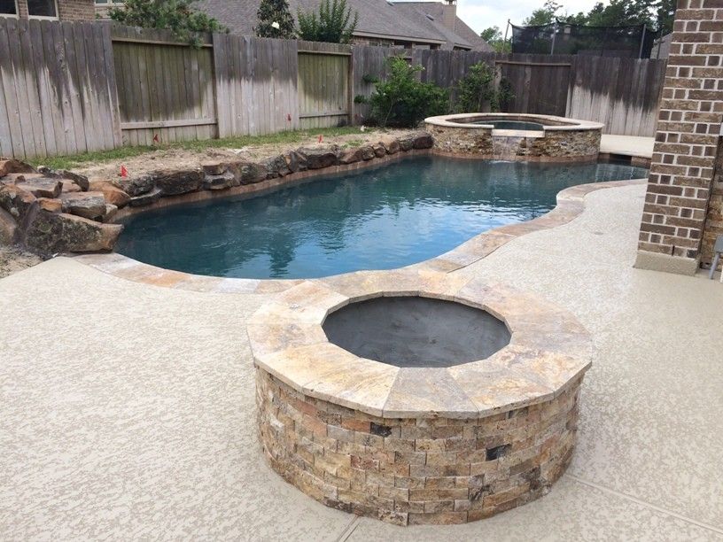 Lowes Memphis for a Rustic Patio with a Indoor Outdoor and Houston Outdoor Kitchen with Traeger Grill and Scabos Split Face Stone by Outdoor Homescapes of Houston