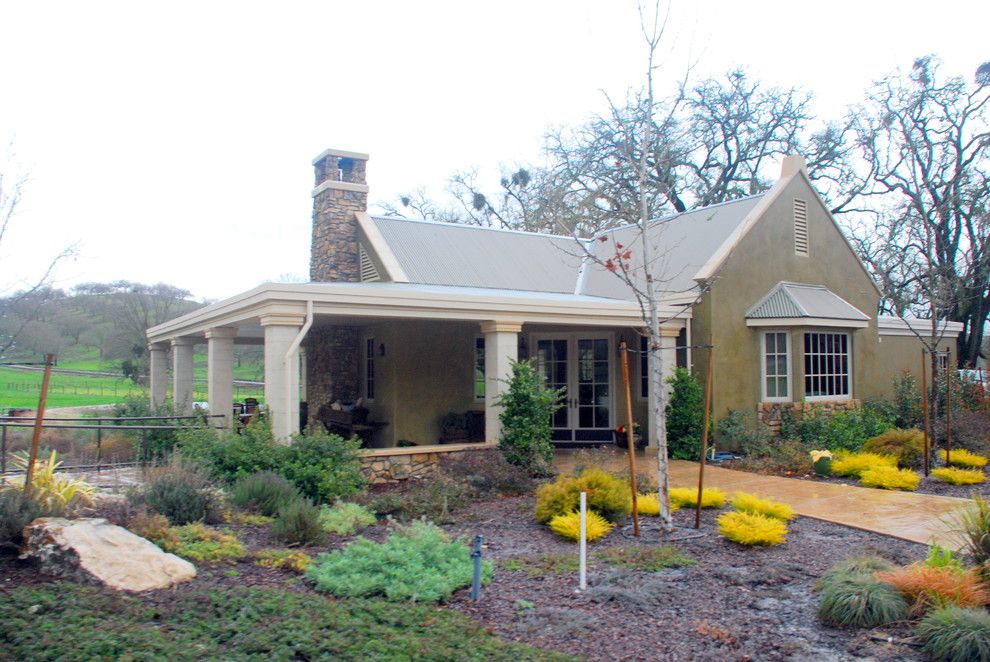 Lowes Paso Robles for a Farmhouse Exterior with a Stucco and Limerock by Odenwald Construction Company