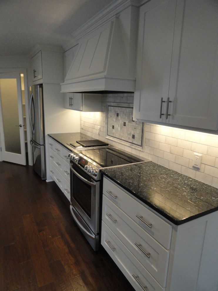 Luna Pearl Granite for a Traditional Kitchen with a White Dove Cabinets and Traditional Kitchen by Jcarstenhomes.com