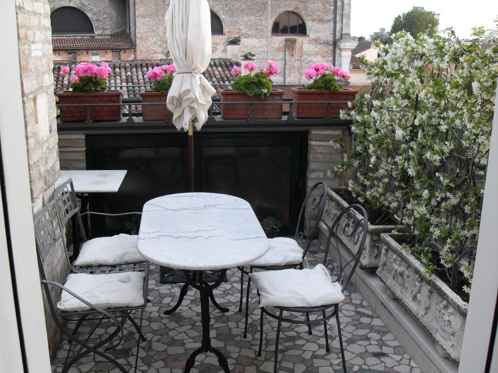 Masins Furniture for a Mediterranean Patio with a Planter Boxes and Alice's House by Alice Masin