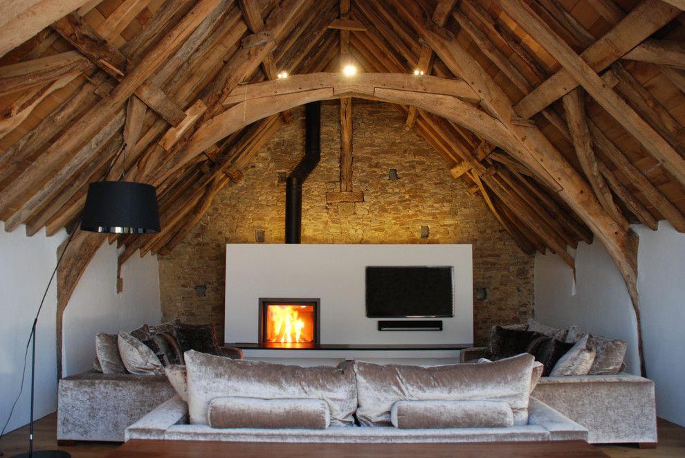 Matthews Building Supply for a Rustic Living Room with a Lime Plaster and Grade Ii* Listed Medieval Barn Conversion, Bude, Cornwall, Uk by the Bazeley Partnership