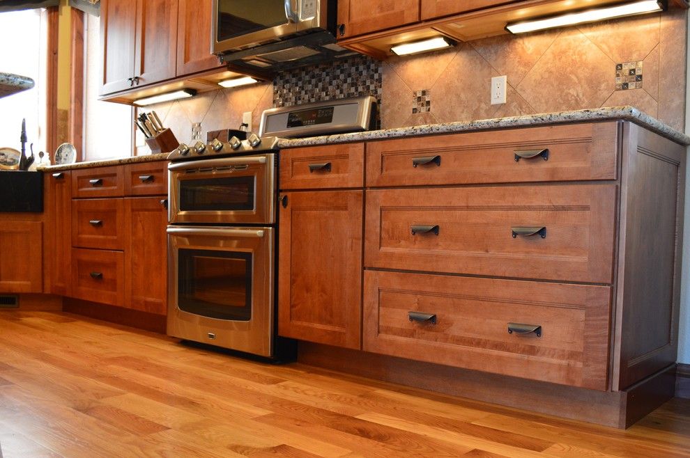 Medallion Cabinets for a Craftsman Kitchen with a Range and Fall Haven by Castle Kitchens and Interiors