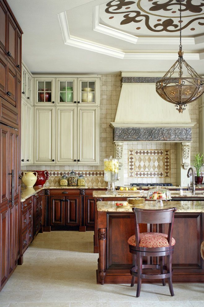 Medallion Cabinets for a Mediterranean Kitchen with a Tile Backsplash and Mediterranean Kitchen by Tobifairley.com