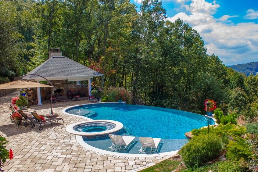 Medallion Pools for a Traditional Pool with a Swim Jets and Sunset Pool by Medallion Pool Co.