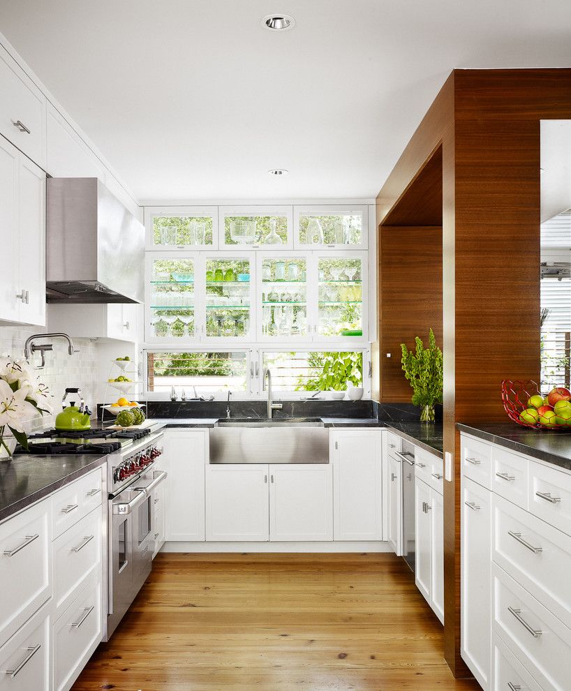 Mid Continent Cabinets for a Midcentury Kitchen with a Stainless Appliances and Kitchen by Chioco Design