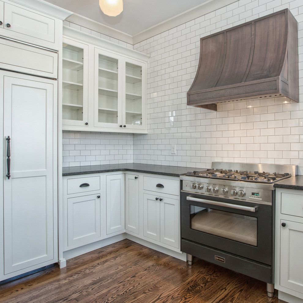 Mid Continent Cabinets for a Modern Kitchen with a Black Countertop and Verona Appliances by Verona Appliances