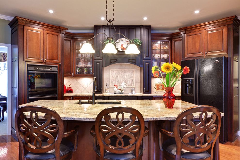 Mid Continent Cabinets for a Traditional Kitchen with a Breakfast Bar and Teri Turan by Turan Designs, Inc.