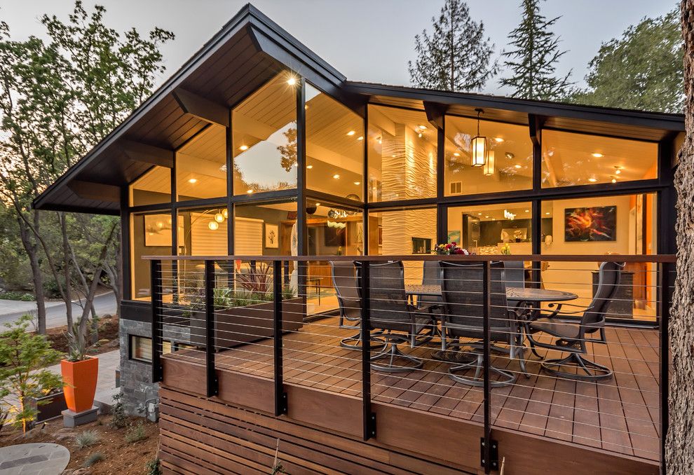 Midcentury Modern for a Contemporary Deck with a Wall of Windows and Mid Century Modern Goes Modern by Ammirato Construction, Inc.