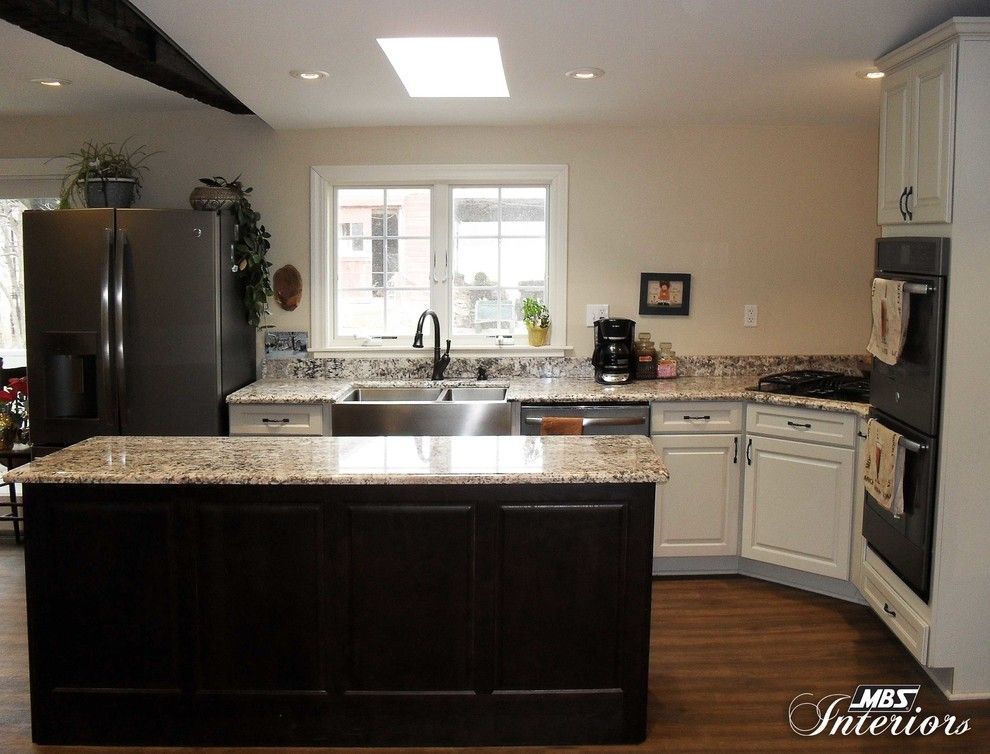 Midcontinent Cabinetry for a Farmhouse Kitchen with a Stainless Steel Farmhouse Sink and Farmhouse Revival by Mbs Interiors