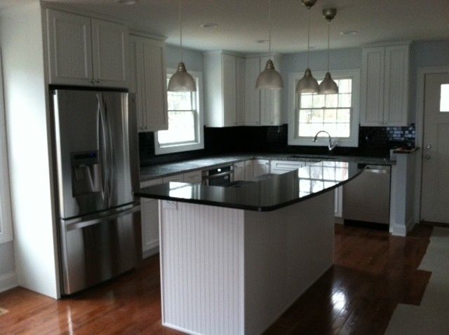 Midcontinent Cabinetry for a Traditional Kitchen with a White Painted Maple Kitchen Cabinetry and Hooper Kitchen by 84 Lumber Co