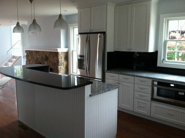 Midcontinent Cabinetry for a Traditional Kitchen with a White Painted Maple Kitchen Cabinetry and Hooper Kitchen by 84 Lumber Co