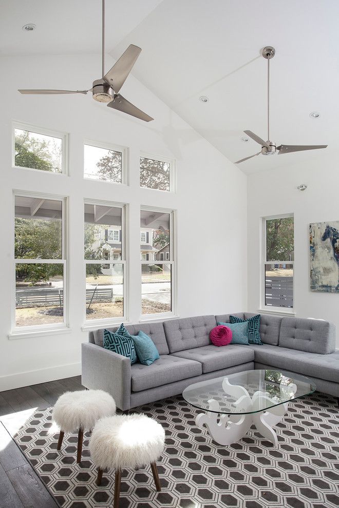 Milliken Doors for a Transitional Living Room with a Gray Sectional Sofa and Spring Lane House by 9 Square Studio