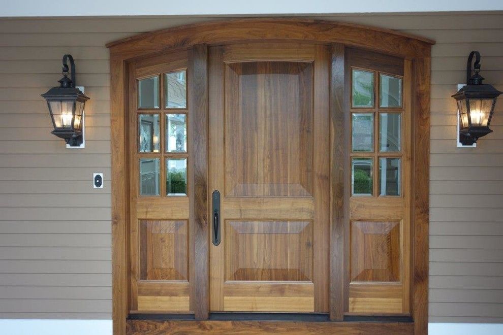 Milliken Millwork for a Rustic Exterior with a Exterior Door and Northern Michigan Home by Thomas & Milliken Millwork, Inc.