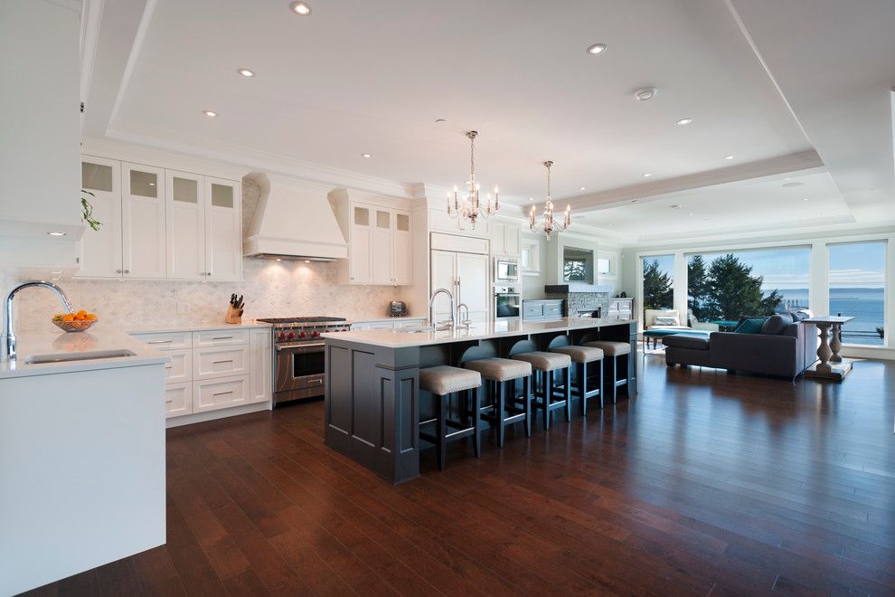 Mirage Hardwood for a Transitional Kitchen with a Huge Island and West Vancouver Horizon by Sarah Gallop Design Inc.