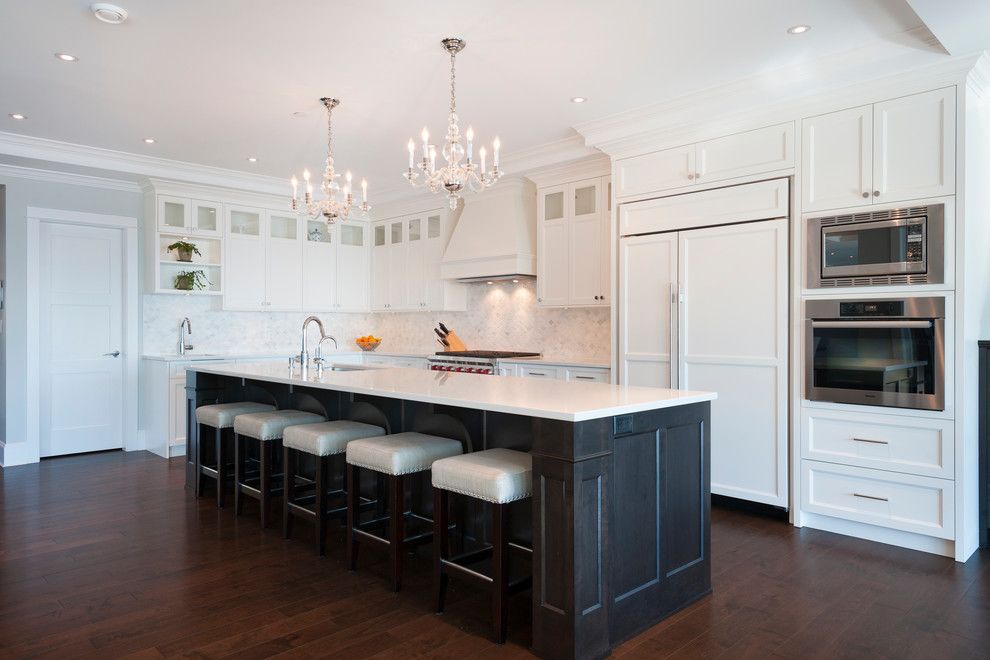 Mirage Hardwood for a Transitional Kitchen with a Wolf Range and West Vancouver Horizon by Sarah Gallop Design Inc.