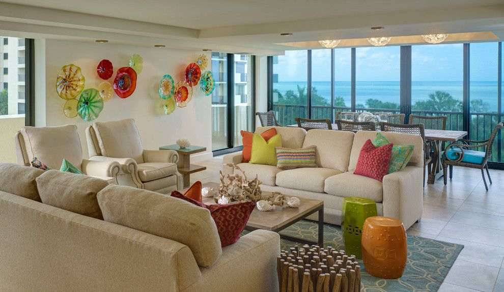 Missing Piece Tampa for a Beach Style Family Room with a Beachfront and Vanderbilt Beach Renovation by Laura Miller Interior Design